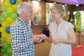 Senior couple in cinema lobby