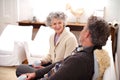 Senior couple, coffee or couch to relax in conversation of happy, memory or bonding together. Older woman, man or tea on Royalty Free Stock Photo