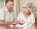 Senior Couple Concerned About Debt Going Through Bills Together Royalty Free Stock Photo