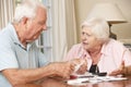 Senior Couple Concerned About Debt Going Through Bills Together Royalty Free Stock Photo