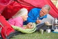 Senior Couple Cooking Breakfast On Camping Holiday Royalty Free Stock Photo