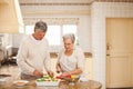 Senior couple cooking in the kitchen Royalty Free Stock Photo