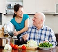 Senior couple cooking vegetarian lunch Royalty Free Stock Photo