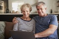 Senior couple on the couch at home using laptop, close up Royalty Free Stock Photo