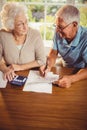 Senior couple counting bills Royalty Free Stock Photo