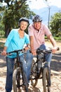 Senior couple on country bike ride Royalty Free Stock Photo