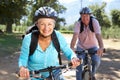Senior couple on country bike ride Royalty Free Stock Photo