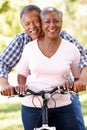 Senior couple cycling in park