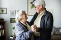 Senior couple dancing together holding hands Royalty Free Stock Photo