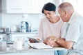 Senior couple debt, tablet and home of elderly people in retirement looking at budget data. Pension, house research and Royalty Free Stock Photo