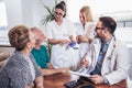 Senior Couple In Discussion With Health Visitor At Home. Royalty Free Stock Photo