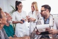 Senior Couple In Discussion With Health Visitor At Home. Royalty Free Stock Photo