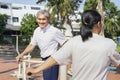 senior couple doing exercise on twist hip exercise machine together Royalty Free Stock Photo