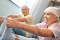 Senior couple doing yoga together at home health care legs stretching close-up Royalty Free Stock Photo