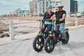 Senior couple, electric bike and ride by the beach for fun bonding activity or travel together in the city. Happy Royalty Free Stock Photo