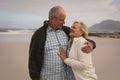 Senior couple embracing each other on the beach Royalty Free Stock Photo