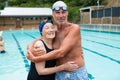 Senior couple embracing each other at poolside Royalty Free Stock Photo