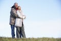 Senior Couple Embracing In Park