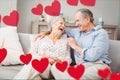 Senior couple embracing on sofa Royalty Free Stock Photo
