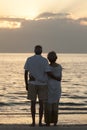 Senior Couple Embracing Sunset Tropical Beach Royalty Free Stock Photo