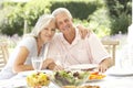 Senior couple enjoying al fresco meal Royalty Free Stock Photo