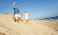 Senior Couple Enjoying Beach Holiday Running Royalty Free Stock Photo
