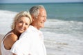 Senior Couple Enjoying Beach Holiday In The Sun Royalty Free Stock Photo