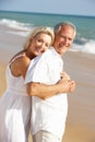 Senior Couple Enjoying Beach Holiday In The Sun Royalty Free Stock Photo