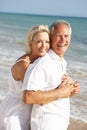 Senior Couple Enjoying Beach Holiday In The Sun Royalty Free Stock Photo