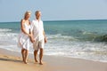 Senior Couple Enjoying Beach Holiday In The Sun Royalty Free Stock Photo