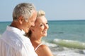 Senior Couple Enjoying Beach Holiday In The Sun Royalty Free Stock Photo