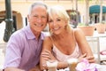 Senior Couple Enjoying Coffee And Cake