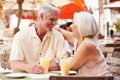 Senior Couple Enjoying Drink In Outdoor CafÃ¯Â¿Â½ Royalty Free Stock Photo