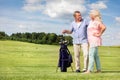 Senior couple enjoying golf game.