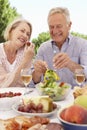 Senior Couple Enjoying Outdoor Meal Together Royalty Free Stock Photo