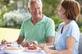 Senior Couple Enjoying Outdoor Meal Together Royalty Free Stock Photo