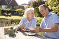 Senior Couple Enjoying Outdoor Summer Snack At Cafe Royalty Free Stock Photo