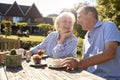 Senior Couple Enjoying Outdoor Summer Snack At Cafe Royalty Free Stock Photo