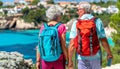 Senior couple enjoying serene pacific coast views during leisurely hike in beautiful nature reserve. Royalty Free Stock Photo