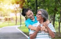 Couple exercise concept. Elderly man and woman relax after exercising together in the public park. Happy smile senior women Royalty Free Stock Photo