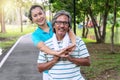 Couple exercise concept. Elderly man and woman relax after exercising together in the public park. Happy smile senior women Royalty Free Stock Photo