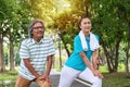 Senior couple exercise concept. man and woman stretching before exercising together in the public park Royalty Free Stock Photo