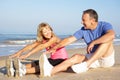 Senior Couple Exercising On Beach Royalty Free Stock Photo