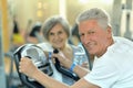 Senior Couple Exercising In gym