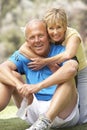 Senior Couple Exercising In Park Royalty Free Stock Photo