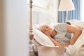 Senior couple fast asleep together in their bed