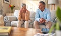 Senior couple, fight and divorce in stress, conflict or argument from disagreement on living room sofa at home. Elderly