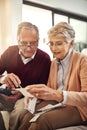 Senior couple, finance and bills in budget check for expenses, receipts or calculating costs at home. Elderly man and Royalty Free Stock Photo