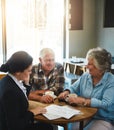 Senior couple, financial advisor and people with paperwork, relax conversation and retirement planning. Insurance Royalty Free Stock Photo