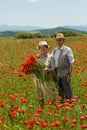 Senior couple on the flower field Royalty Free Stock Photo
